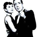 A black and white stencil style painting of Audrey Hepburn and Humphrey Bogart embracing